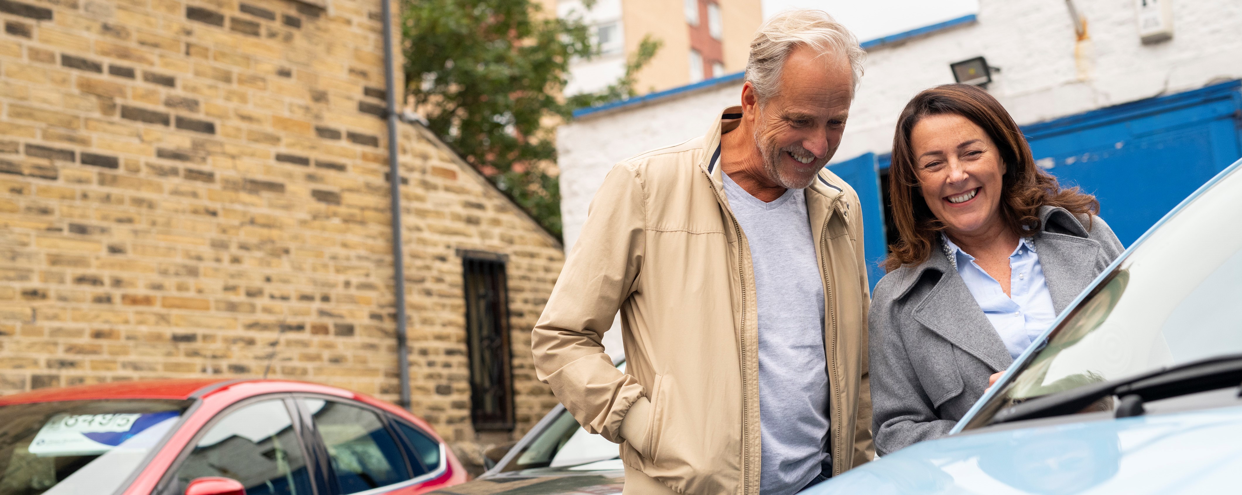 couple looking at a car