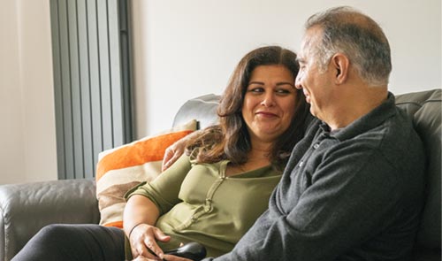 Smiling couple on the sofa