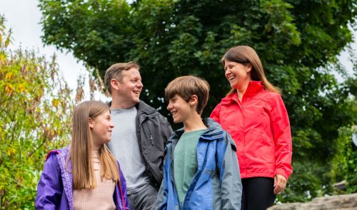 family laughing in garden