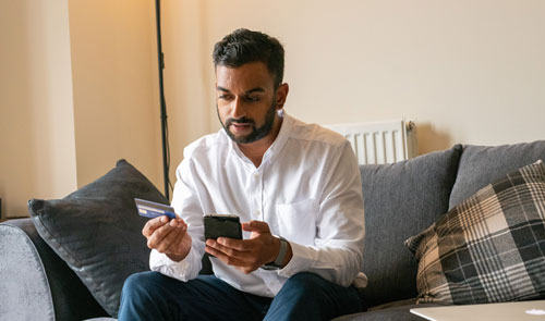 man shopping on mobile