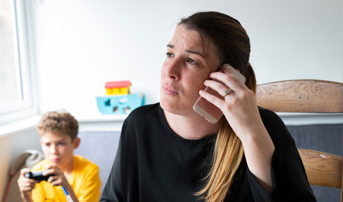 woman worried on phone