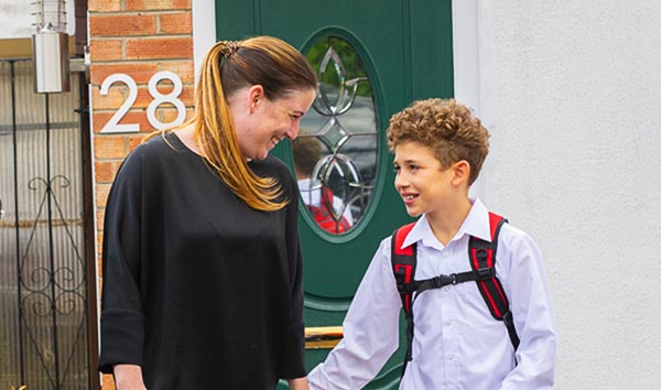 mum and son outside front door