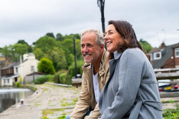 Couple sat near a canal