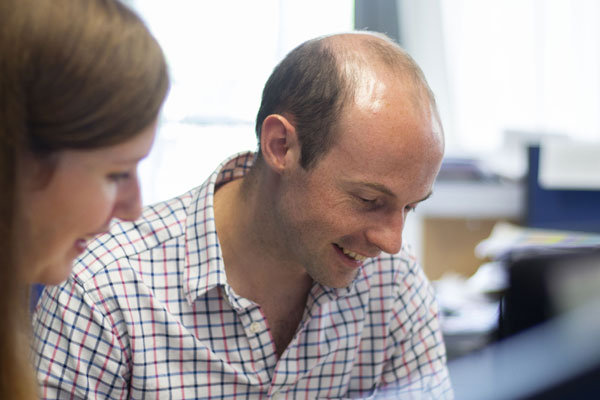 colleagues smiling in the office