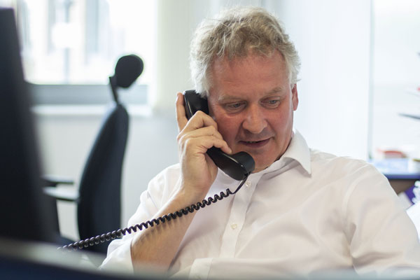 man smiling on the phone