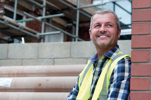 male builder smiling