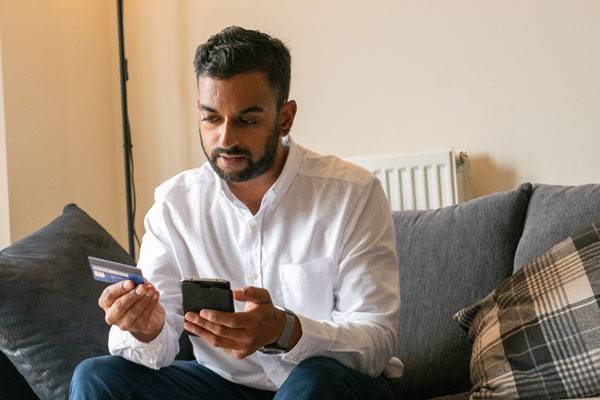 man shopping on phone