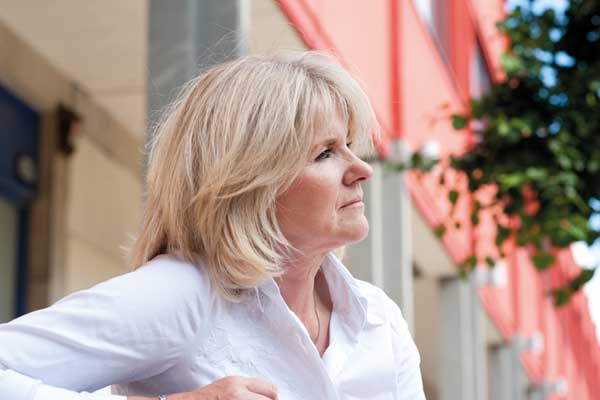 blonde woman looking into the distance