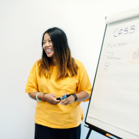 Colleague writing on a whiteboard