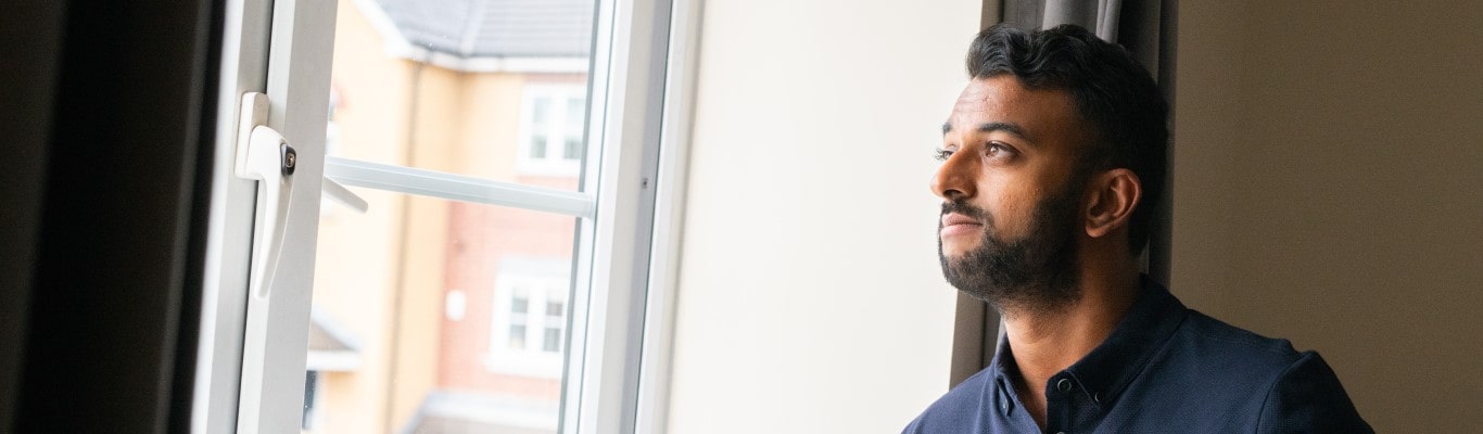 Man looking out of the window