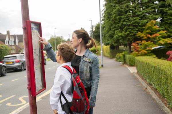 mum and son waiting for the bus