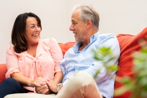 smiling couple on sofa