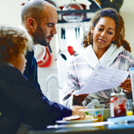 family looking at household bill