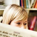 Woman reading newspaper